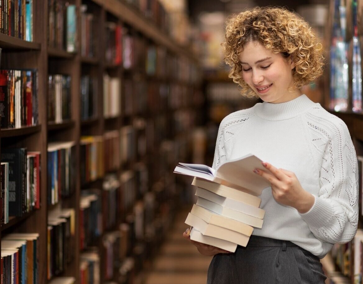 young-librarian-organising-books